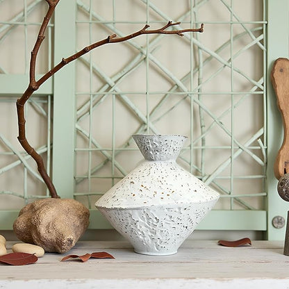White hammered cast iron vase with angled neck, speckled surface, decorative tabletop display