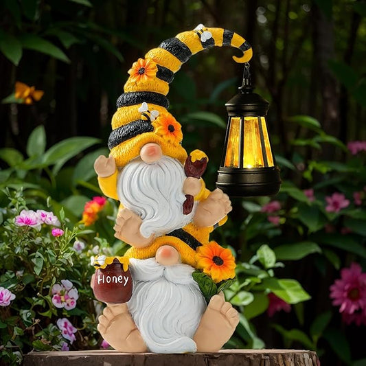 Bee-themed garden gnome statue holding a solar LED lantern, white beard, yellow stripes