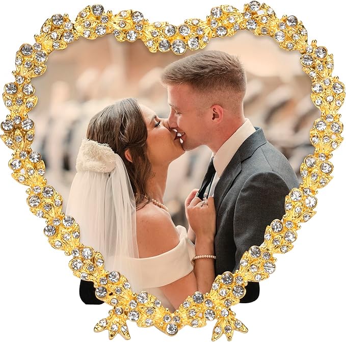 Golden heart-shaped wedding picture frame with crystal beaded border, holding couple photo