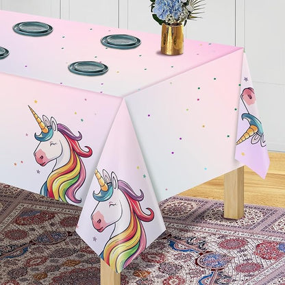 Pink unicorn plastic tablecloth with rainbow unicorns, star speckles, and hanging corner