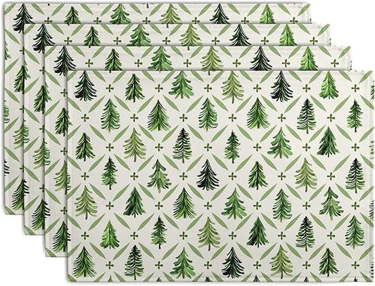 Set of 4 sage green pine tree Christmas placemats, rectangular with repeating print.