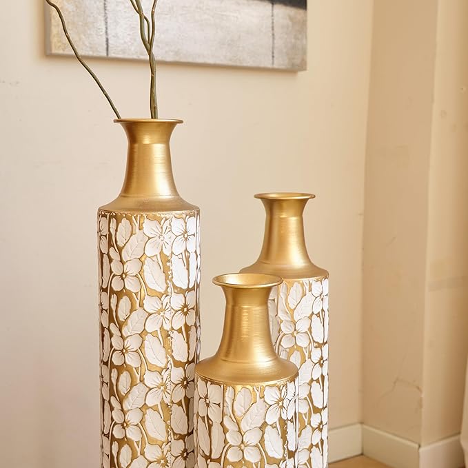 Three twig-pattern metal floor vases in antique white with gold necks and rims