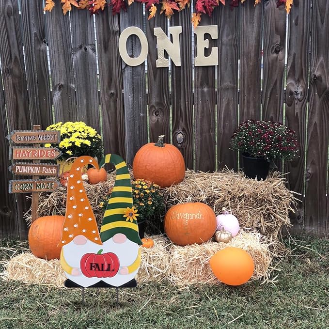 Thanksgiving fall gnome stake with orange polka-dot outfit, green striped hat, and “FALL” pumpkin
