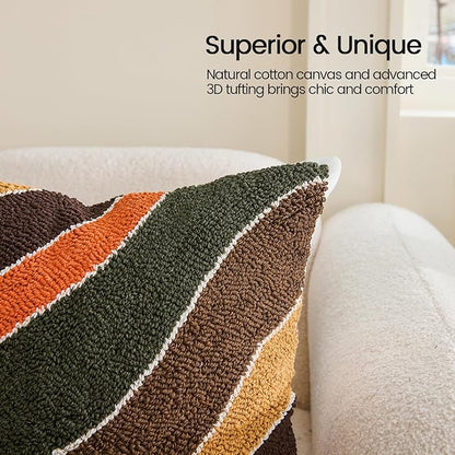 Tufted pillow cover close-up with curved stripe bands in dark green, brown, tan, and orange
