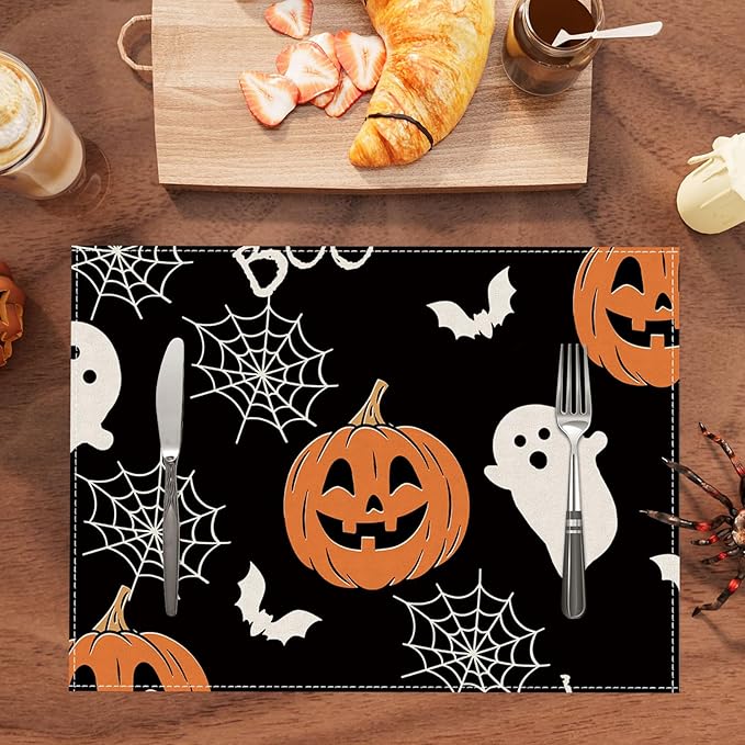 Halloween placemat set: rectangular black mat with jack-o'-lantern, ghost, bats, webs.