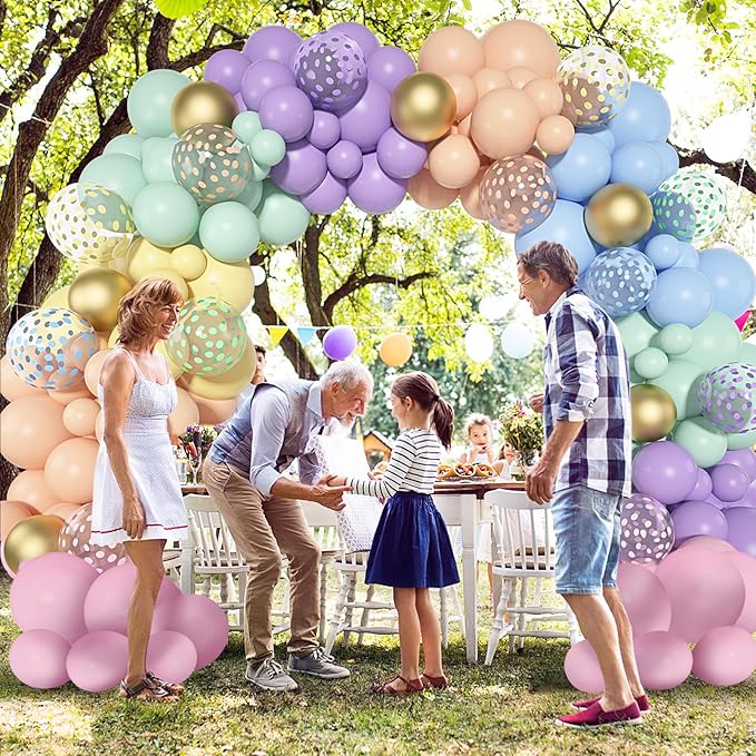 Pastel balloon arch garland with gold accents and confetti-pattern balloons in a large arch shape