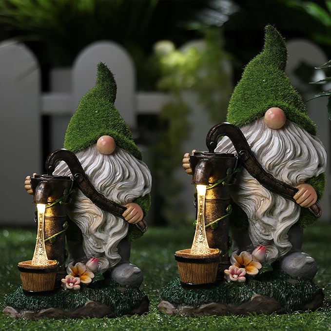 Pair of solar-powered resin garden gnomes with green caps, white beards, and glowing lanterns