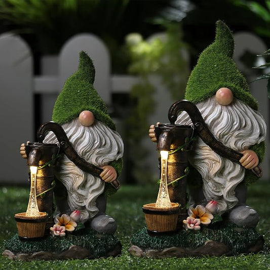 Pair of solar-powered resin garden gnomes with green caps, white beards, and glowing lanterns