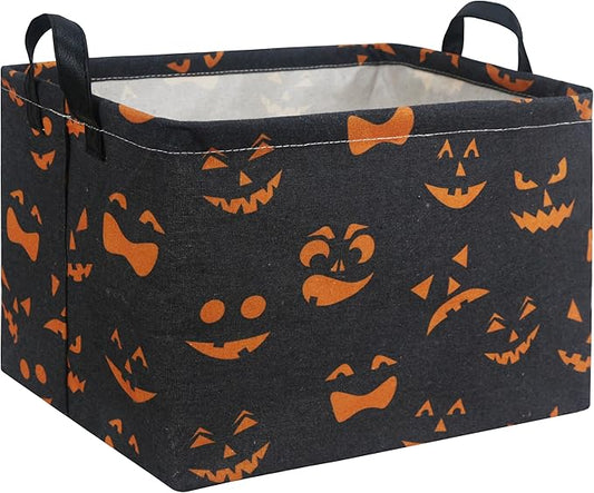 Rectangular Halloween storage basket, black fabric with orange jack-o-lantern and bat patterns, handles