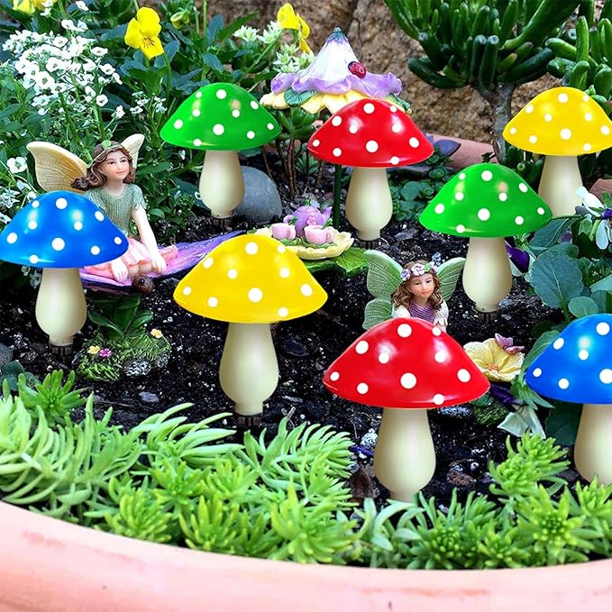 Solar mushroom LED lights with red, blue, green, and yellow caps and glowing stems