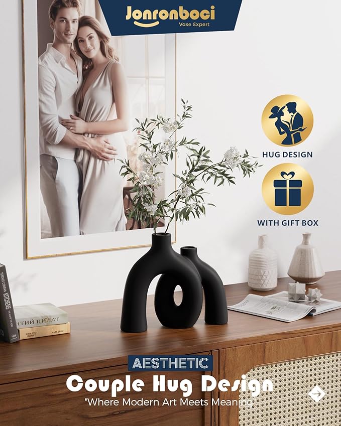 Matte black ceramic hug vase sculpture with two conjoined domes and oval openings