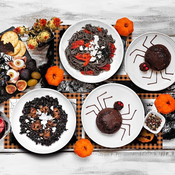Halloween paper placemat with plaid border and spiderweb jack-o'-lantern illustrations