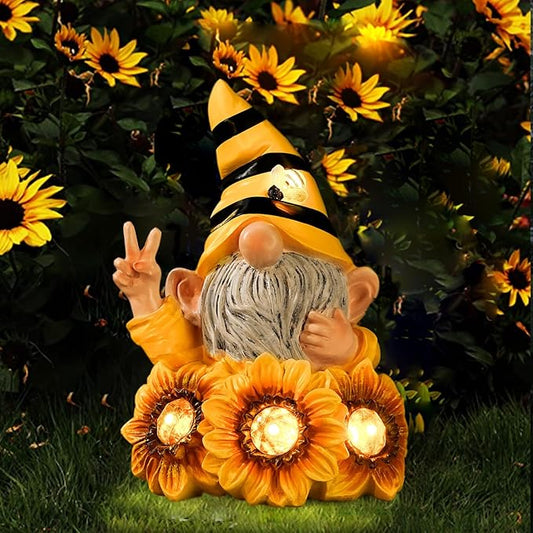 Bee-striped yellow-and-black gnome solar light statue with gray beard and sunflower base