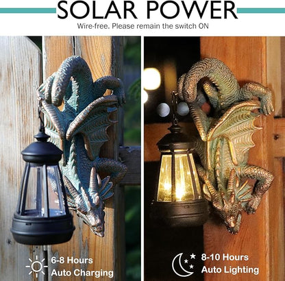 Gothic dragon tree hugger statue with solar lantern on wooden fence, dark bronze body