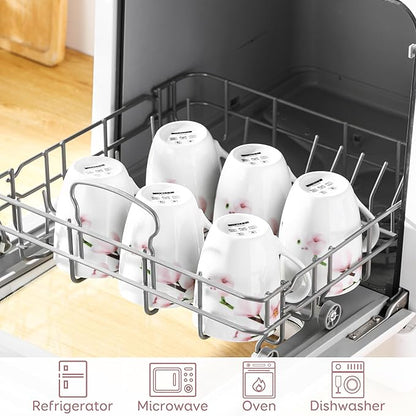 Floral ceramic coffee mugs in dishwasher rack, white cups with pink flower accents
