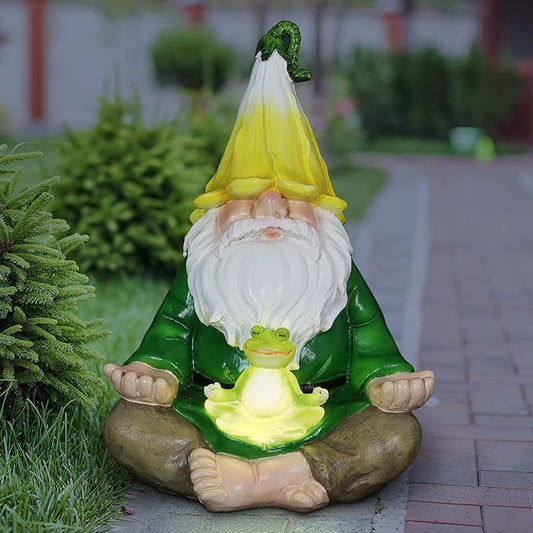 Glowing LED meditating gnome statue with small green frog, seated cross-legged on a base