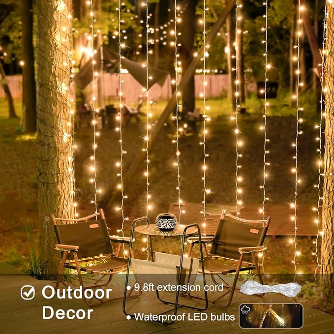 Warm white LED curtain string lights hanging in rows for outdoor wall decor, close-up view