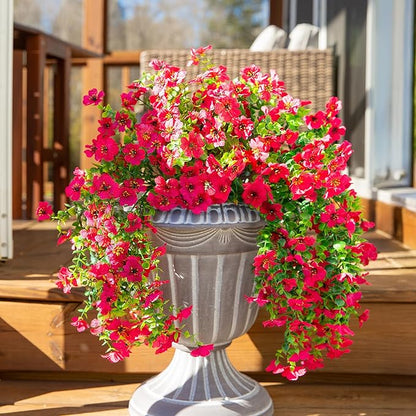 Hot pink faux daisy hanging flower bundles with cascading green trailing greenery
