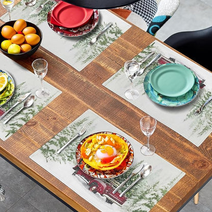 Christmas placemats on dining table with plates and drinks; red truck and pine print