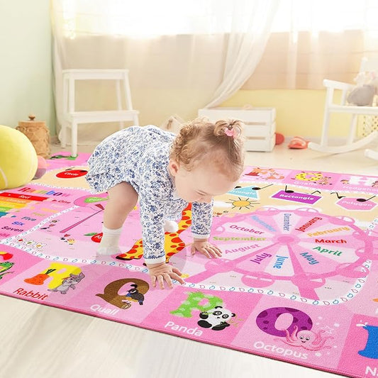 Pink kids educational rug with alphabet, animal pictures, and colorful month blocks.