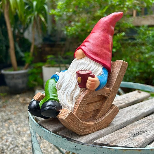 Garden gnome figurine holding a mug while seated on a wooden rocking chair