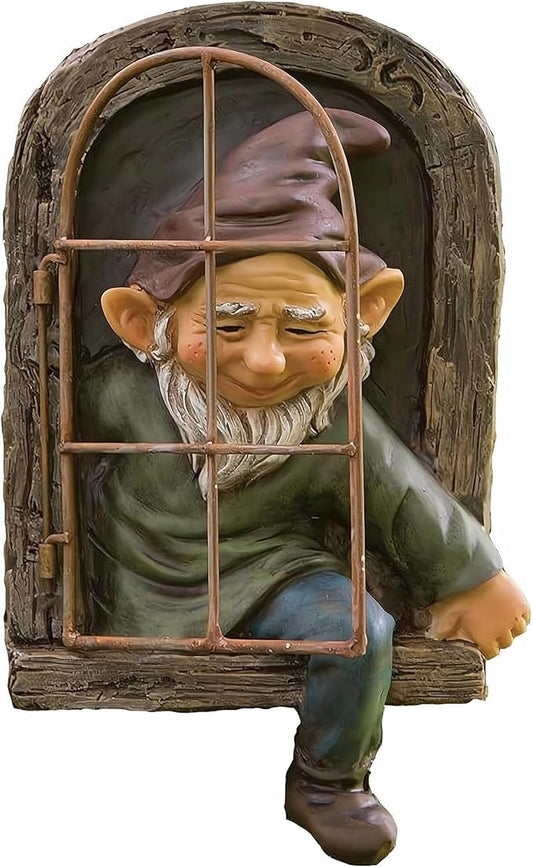 Gnome garden statue peeking through arched window frame, green outfit and white beard