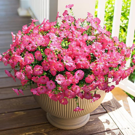 Pink faux morning glory flower bundle with green leaves in a round planter