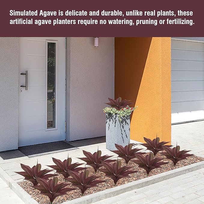 Potted purple-red artificial agave plants along an outdoor walkway and garden bed.