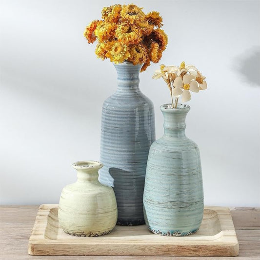 Set of 3 ceramic vases with ribbed texture in blue, light green, and cream