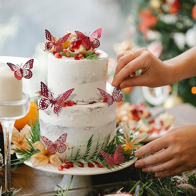 Red 3D butterfly decals placed on a decorated tiered cake