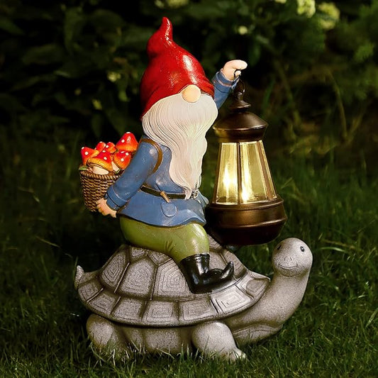 Red gnome statue holding a solar lantern on a turtle shell base with a small basket