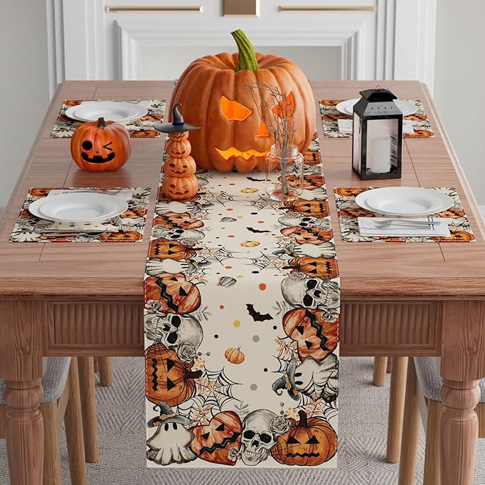 Halloween table runner featuring skeleton, ghost, and pumpkin motifs in orange and black