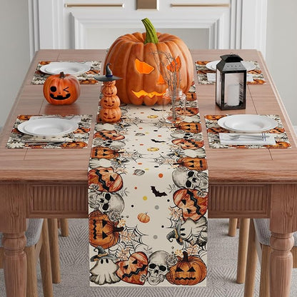 Halloween table runner featuring skeleton, ghost, and pumpkin motifs in orange and black