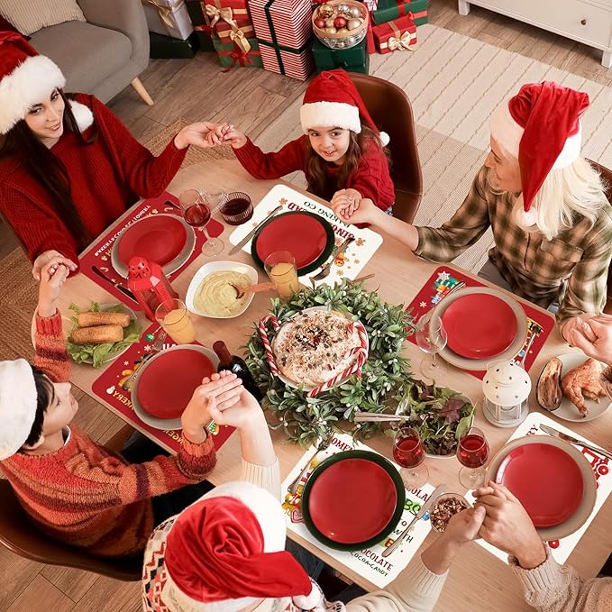 Six Christmas gingerbread table mats on holiday gathering table with red placemat centers