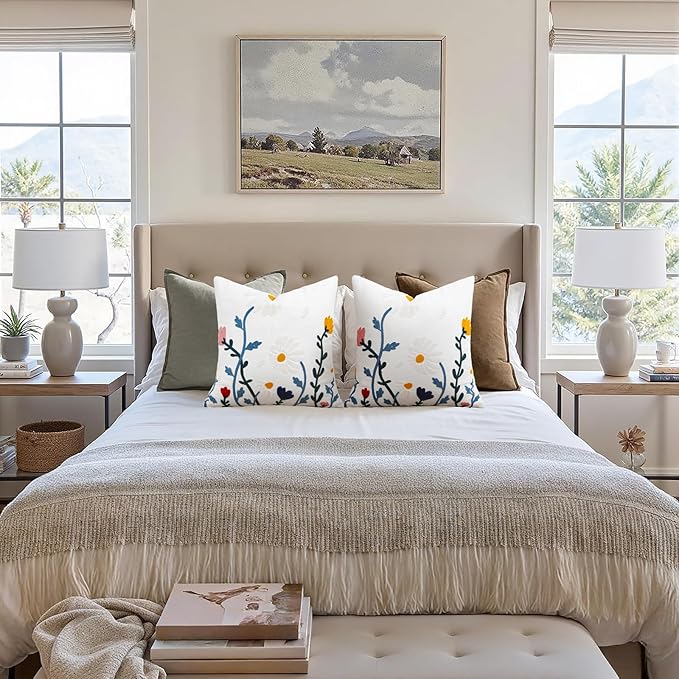 White square pillow cover with embroidered flower vine pattern in blue and yellow