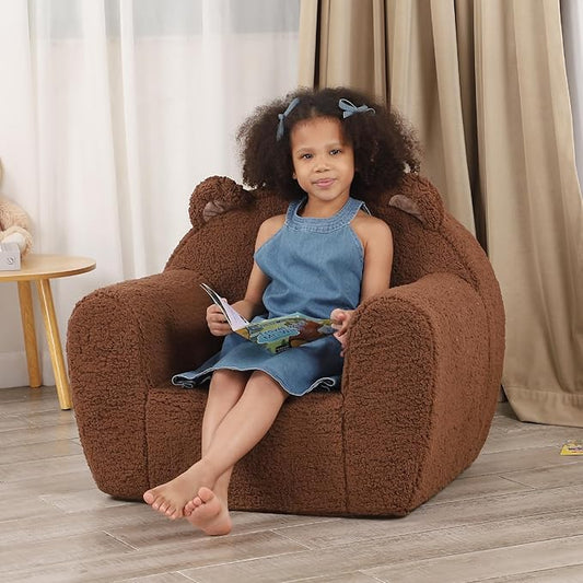 Brown plush teddy bear kids chair with bear ears, rounded armrests, and top handle