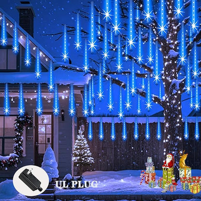 Blue LED icicle and meteor shower lights hanging from trees and porch eaves