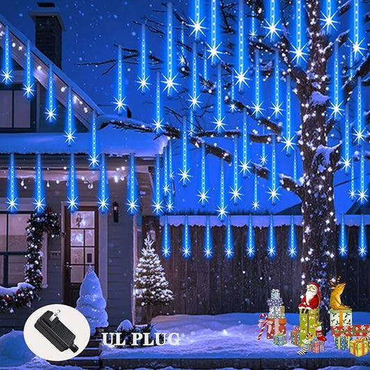 Blue LED icicle and meteor shower lights hanging from trees and porch eaves