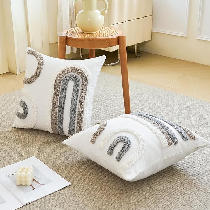 White tufted pillow covers with gray arched patterns, styled on couch