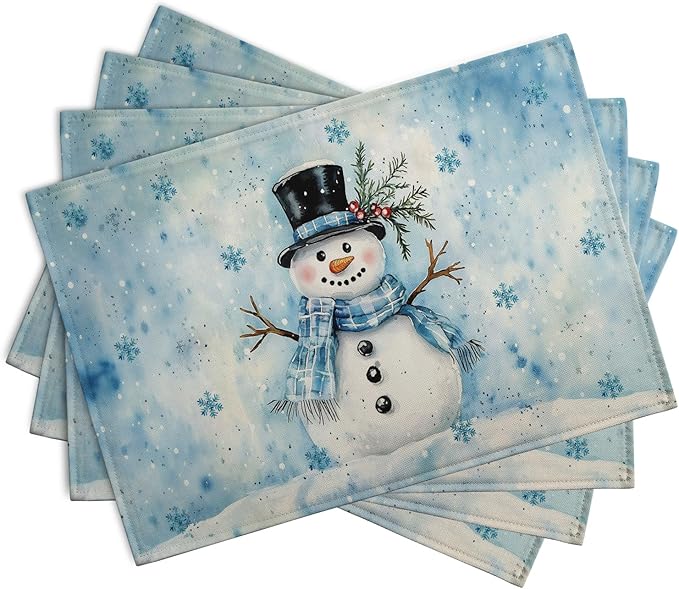 Blue rectangular winter placemats set of 4 featuring snowman and scattered snowflakes.