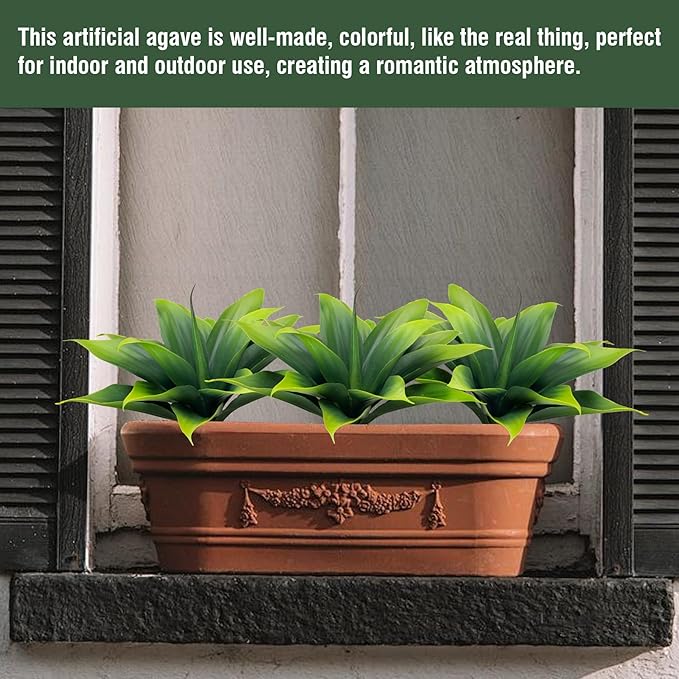 Green faux agave plant in terracotta planter, spiky leaves
