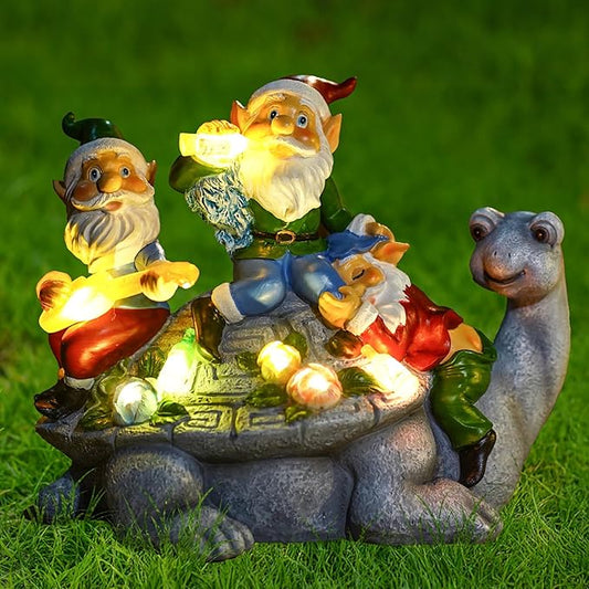 Solar LED gnome statue: three gnomes with glowing lights on turtle, holding flowers