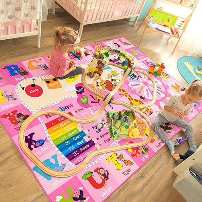 Pink alphabet and animal kids play rug with large curved paths and letter labels.