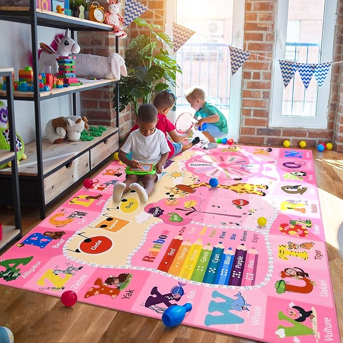 Pink kids learning rug featuring animal and number/letter areas across the surface.
