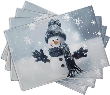 Blue snowman placemats stacked, snowflake pattern and snowman figure, set of 4