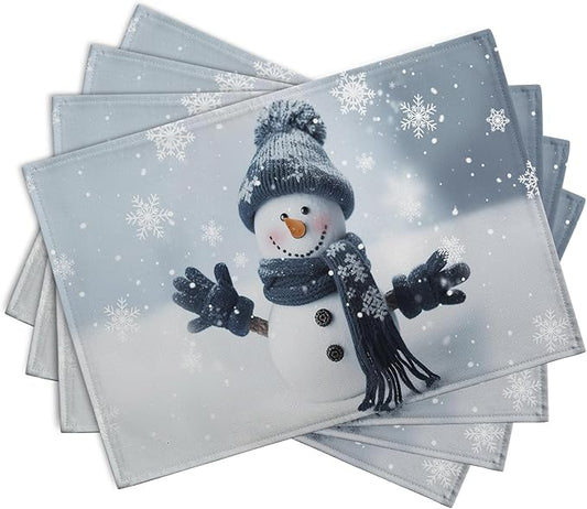 Blue snowman placemats stacked, snowflake pattern and snowman figure, set of 4