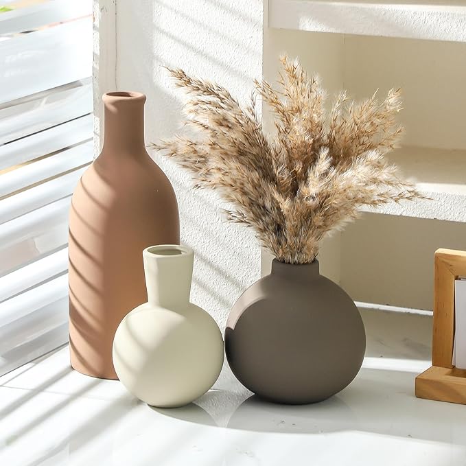 Set of 3 matte ceramic vases: tall terracotta, small white round, dark taupe bottle