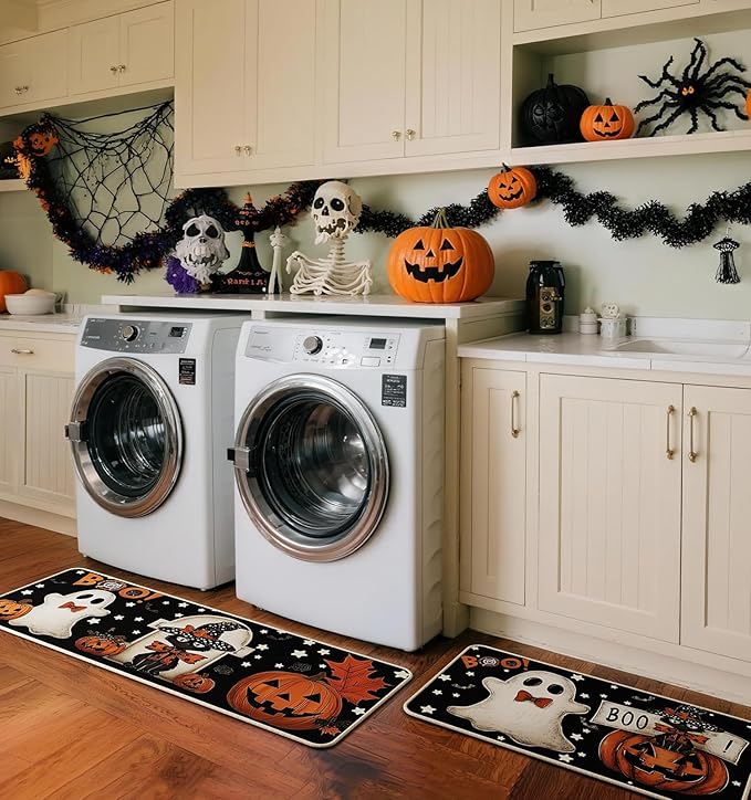 Halloween kitchen mat set on wood floor with ghost, pumpkins, bats and cat faces