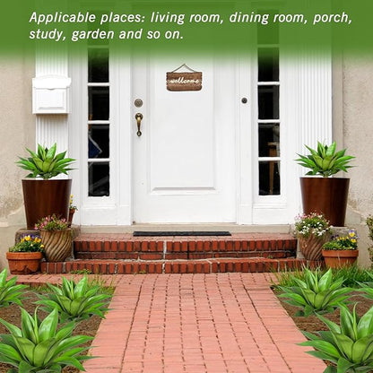 Faux agave plants in brown pots arranged along an outdoor walkway
