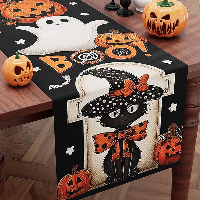 Black Halloween table runner with white ghost, jack-o-lantern pumpkins and spiderweb motifs
